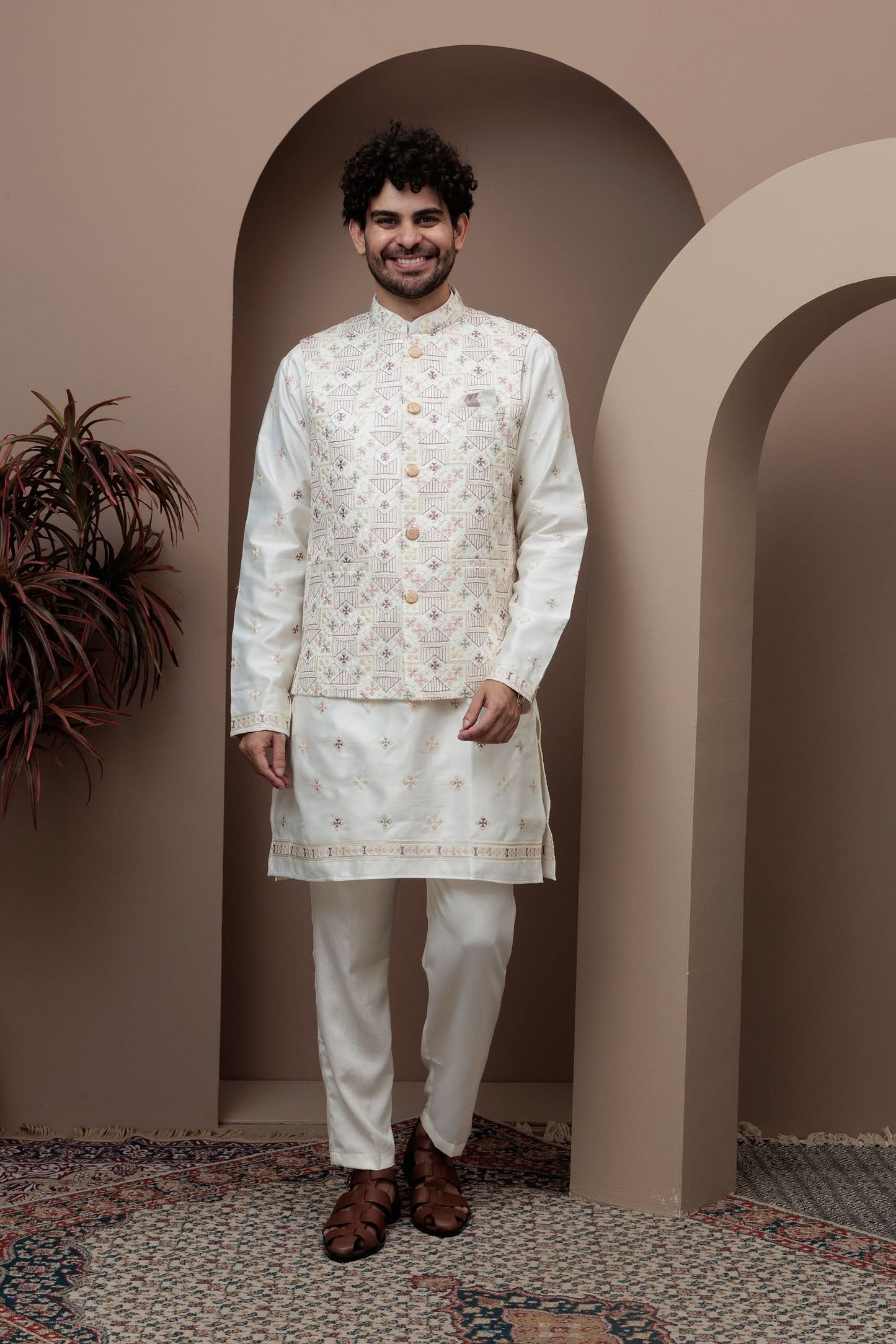 White kurta pajama with matching embroidered jacket