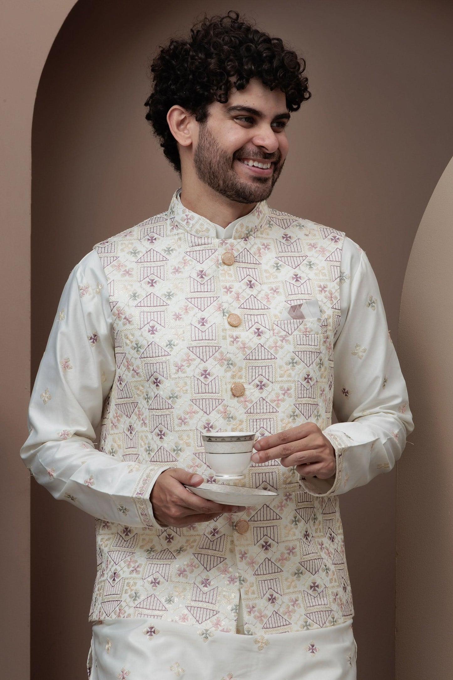 White kurta pajama with matching embroidered jacket