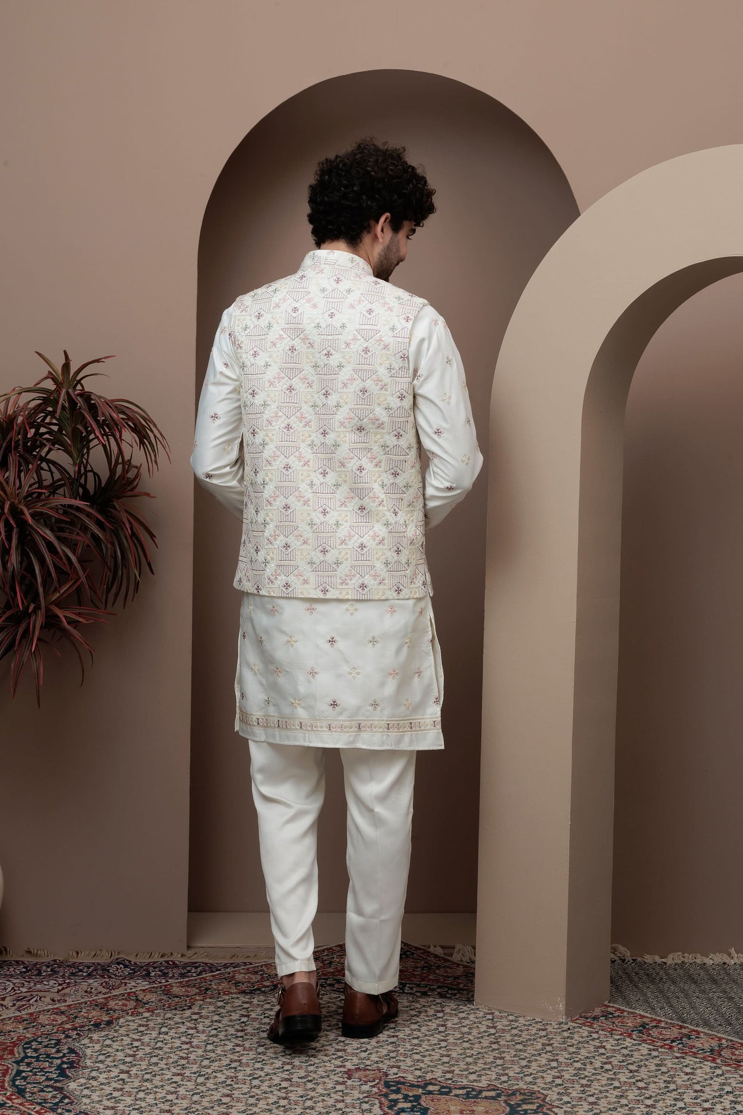White kurta pajama with matching embroidered jacket