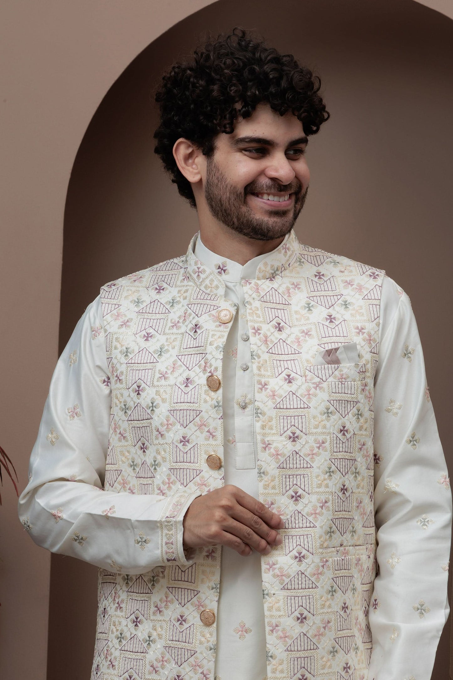 White kurta pajama with matching embroidered jacket
