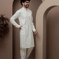 White kurta pajama with matching embroidered jacket