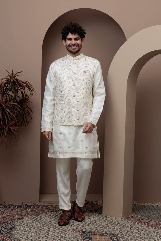 White kurta pajama with matching embroidered jacket
